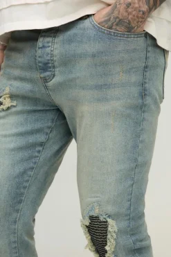 Store boohooMAN Tall Biker Rip & Repair Zip Hem Skinny Jeans stonewash