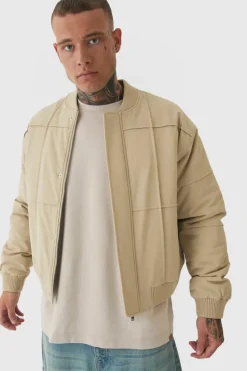 Online boohooMAN Tall Boxy Panel Padded Nylon Bomber Jacket In stone