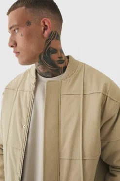 Online boohooMAN Tall Boxy Panel Padded Nylon Bomber Jacket In stone