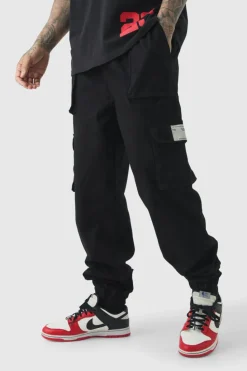 Fashion boohooMAN Tall Cuffed Hem Woven Tab Cargo Trousers In black
