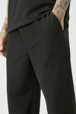New boohooMAN Tall Elasticated Lightweight Technical Stretch Relaxed Fit Trousers black