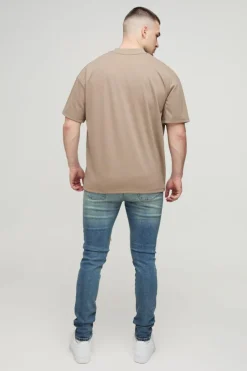 Shop boohooMAN Tall Extreme Rip Busted Knee Skinny Jeans mid wash