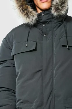 Shop boohooMAN Tall Faux Fur Hooded Arctic Parka Jacket in charcoal