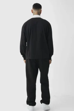 Shop boohooMAN Tall Oversized Applique Rugby Polo black