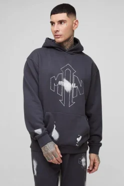 Shop boohooMAN Tall Oversized Man Paint Splatter Hooded Relaxed Flare Tracksuit black