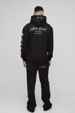 Shop boohooMAN Tall Oversized Official Embroidery Hooded Relaxed Flare Tracksuit black