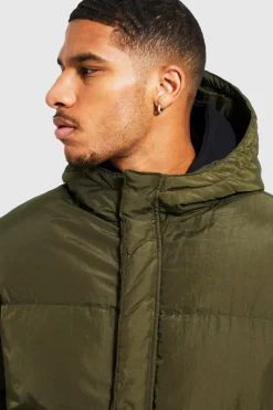 Shop boohooMAN Tall 4 Pocket Longline Hooded Puffer Jacket in khaki