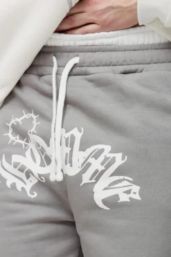 Shop boohooMAN Tall Relaxed Double Waistband Heart Print Jogger charcoal