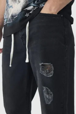Sale boohooMAN Tall Relaxed Ripped Let Down Hem Jeans With Extended Drawcords washed black