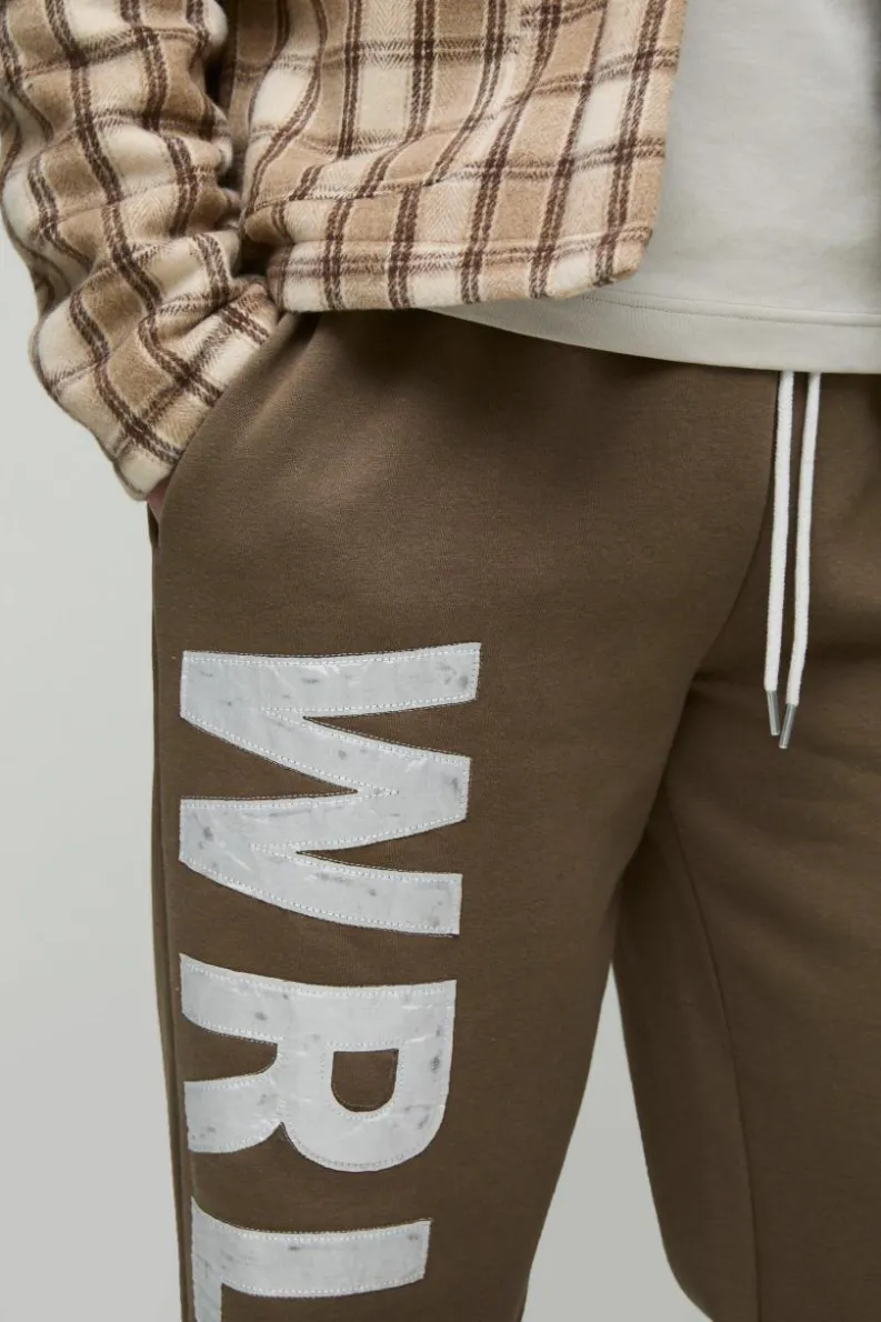 Hot boohooMAN Tall Relaxed Satin Applique WRLDWD Jogger brown