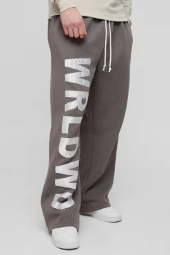 Shop boohooMAN Tall Relaxed Satin Applique WRLDWD Jogger charcoal