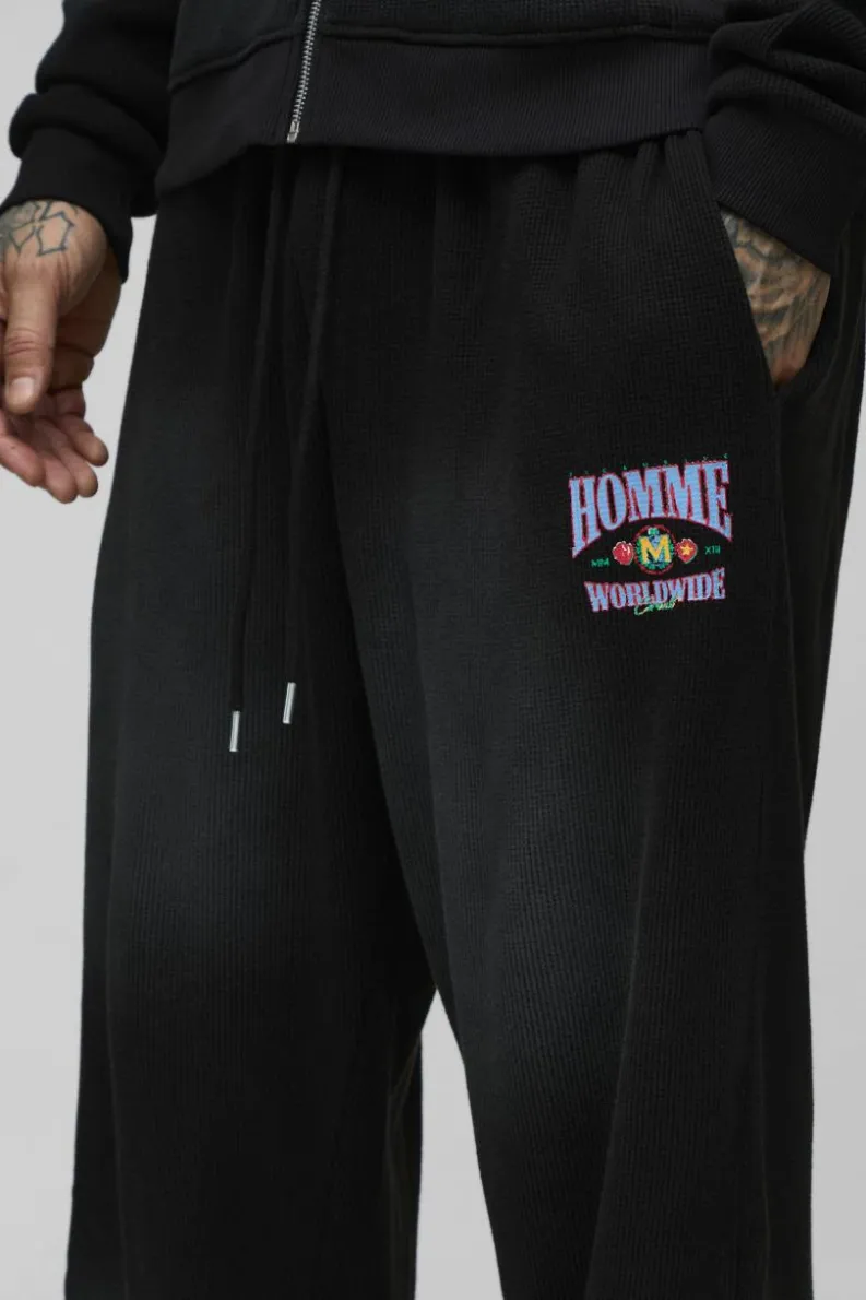 Fashion boohooMAN Tall Spray Wash Waffle Graphic Oversized Jogger washed black
