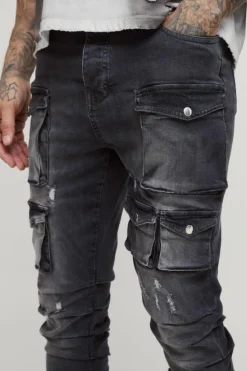 Shop boohooMAN Tall Stacked Multi Cargo Pocket Flared Jeans grey