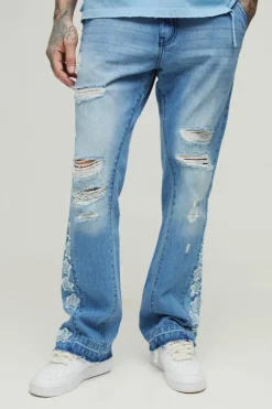 Shop boohooMAN Tall Star Applique Gusset Distressed Flared Jeans antique blue
