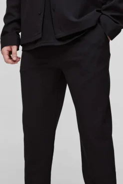 Store boohooMAN Tall Stretch Woven Tapered Trousers black