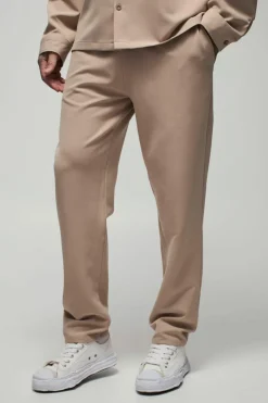 Fashion boohooMAN Tall Stretch Woven Tapered Trousers stone