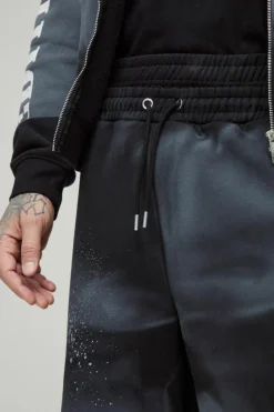 Sale boohooMAN Tall Wide Fit Boxer Spray Wash Embroidered Split Hem Jogger black
