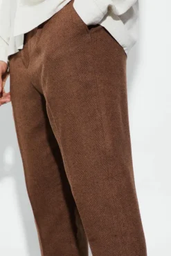 Shop boohooMAN Tapered Fit Herringbone Suit Trousers brown