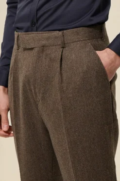 Shop boohooMAN Tapered Fit Herringbone Suit Trousers brown