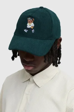Shop boohooMAN Teddy Cord Cap forest