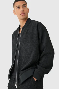 Shop boohooMAN Textured Satin Oversized Bomber Jacket black