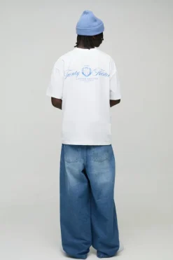 Shop boohooMAN Twist Seam Parachute Jeans light wash