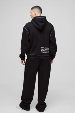 Shop boohooMAN Wide Leg Contrast Stitch Printed Joggers black