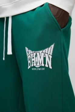 Store boohooMAN Wide Leg Varsity Mesh Applique Jogger forest