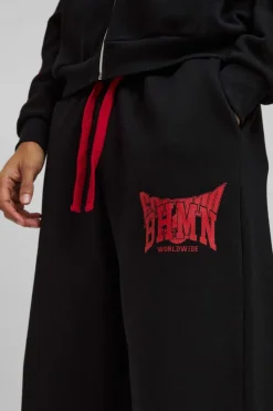 Shop boohooMAN Wide Leg Varsity Mesh Applique Jogger black